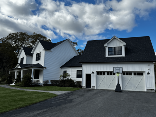 Clean residential driveway after professional exterior cleaning